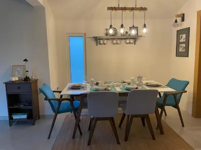 a dining room with a table and chairs at Una Verde in Bihać