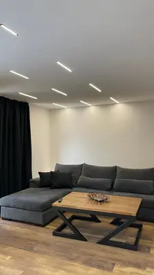 a living room with a couch and a coffee table at Apartments B&M in Visoko