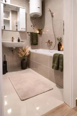 a bathroom with a tub and a sink and a shower at Loft Lux in Banja Luka