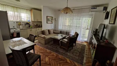a living room with a couch and a table at TUZLA ViVa 2 in Tuzla