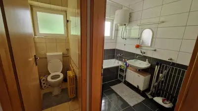 a bathroom with a toilet and a sink at TUZLA ViVa 2 in Tuzla