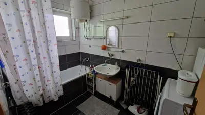 a bathroom with a sink and a bath tub at TUZLA ViVa 2 in Tuzla