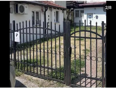 an iron gate in front of a house at Central 13 in Tuzla