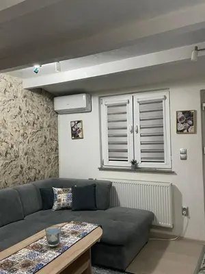a living room with a couch and a table at Central 13 in Tuzla