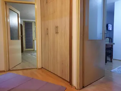 an open door to a room with a hallway with a door at Apartment Lamele Bugojno in Bugojno