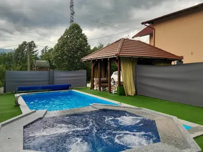 a swimming pool in a yard with a gazebo at Villa Panorama in Bihać