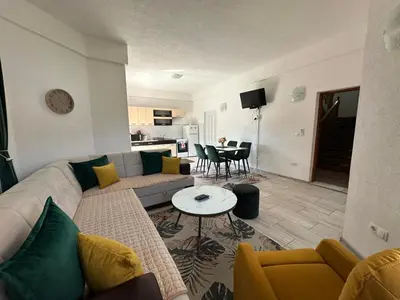 a living room with a couch and a table at Villa Panorama in Bihać