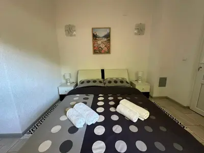 a bedroom with a bed with two pillows on it at Villa Panorama in Bihać