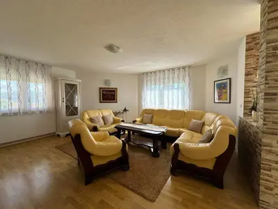a living room with a couch and chairs and a table at Villa Panorama in Bihać