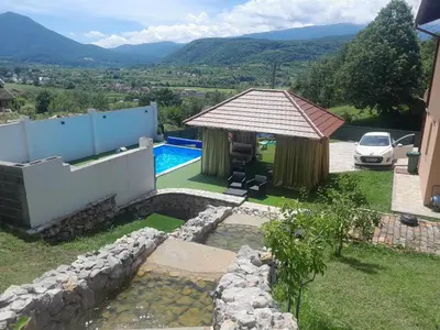 a villa with a swimming pool and a house at Villa Panorama in Bihać