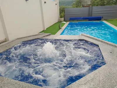 a swimming pool with a large pool of water at Villa Panorama in Bihać