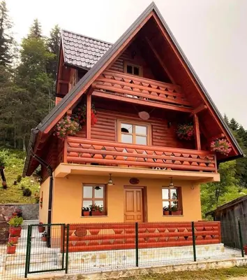 a small house with a brown roof at Planinska kuca za odmor-Mlinista in Landeke