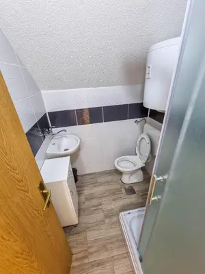 a bathroom with a toilet and a sink at Aparthouse Bilic in Jajce