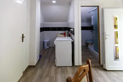 a small bathroom with a sink and a toilet at Aparthouse Bilic in Jajce