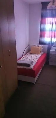 a small bed in a room with a window at MIMA in Jajce