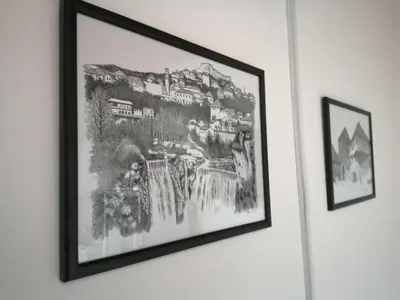 a picture hanging on a wall in a room at Studio Apartman Sun in Jajce