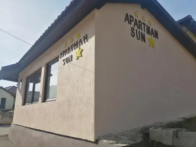 a building with the words aprilman sun on it at Studio Apartman Sun in Jajce