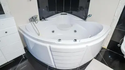 a white bath tub in a bathroom with a sink at Villa De Luxe in Bihać
