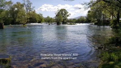 a river with the words river ultra river renovations meters from the participant at Apartman 