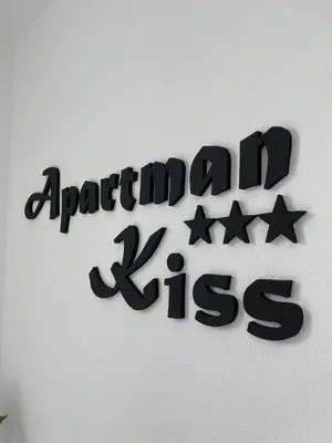 a sign on a wall that reads april zeus at Apartman Kis in Jajce