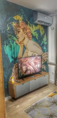 a mural of a mermaid on a wall in a room at Intime by Nights & Smiles in Tuzla