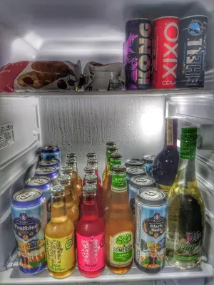 an open refrigerator filled with lots of bottles of beer at Intime by Nights & Smiles in Tuzla
