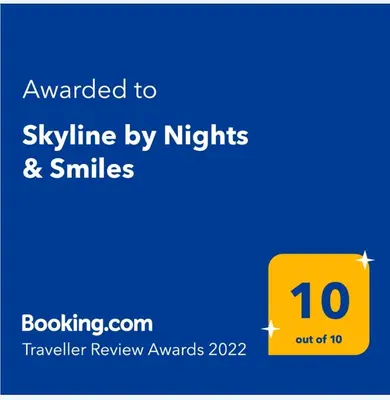 a yellow sign that reads awaken to skyline by nights and smiles at Skyline by Nights & Smiles in Tuzla
