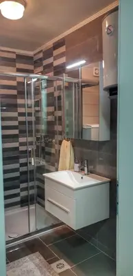 a bathroom with a sink and a shower at Skyline by Nights & Smiles in Tuzla