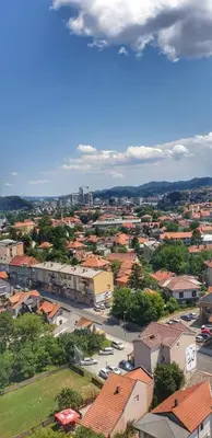 an overhead view of a town with buildings and cars at Skyline by Nights & Smiles in Tuzla