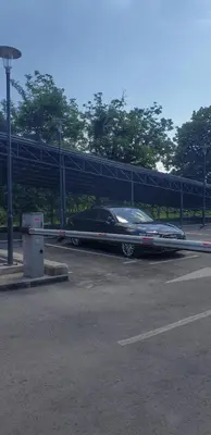 a car is parked in a parking lot at Identity By Nights & Smiles in Tuzla