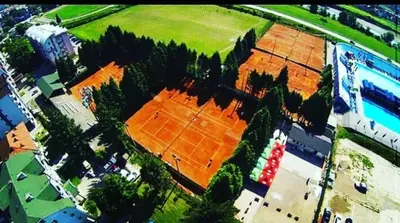an overhead view of a tennis court with trees at Apartment CITY in Doboj