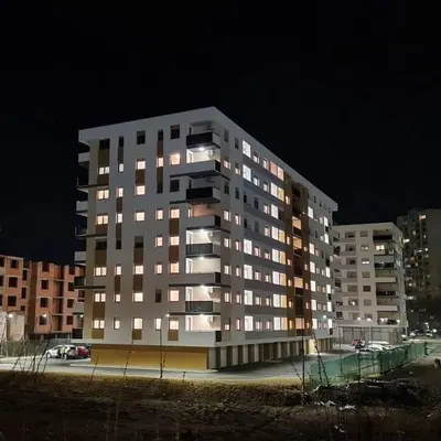 a large apartment building at night with lights on at Apartman La Valletta, Doboj in Doboj