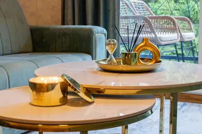 a coffee table with a tray and utensils on it at Apartman Monti Vlašić in Vlasic