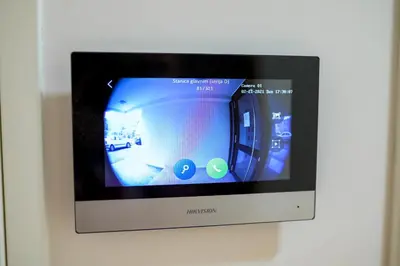 a television with a screen on a wall at Sun Square Apartments in Tuzla