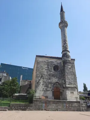 an old brick building with a tall tower on top at Babalina's Place in Bihać