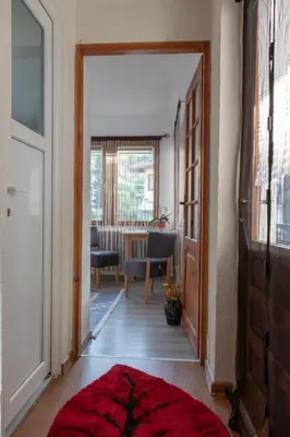 a hallway with a door leading to a dining room at Orhideja Visoko in Visoko