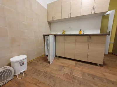 a kitchen with a counter and a dishwasher at Apartmani Sarti Banja Luka in Banja Luka