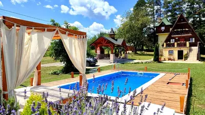 a swimming pool in a yard with a house at Apartman Brezuljak Banja Luka Cokorska polja in Macanovići
