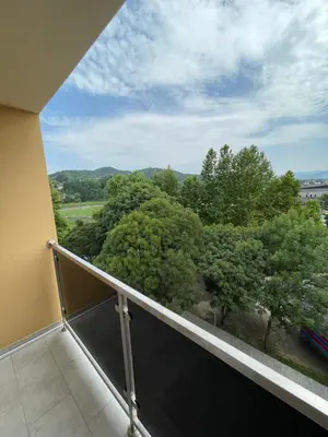 a balcony with a view of trees at Prestige Apartment Teslic in Teslić