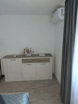 a room with a desk in the corner of a room at Apartman Alma in Bihać