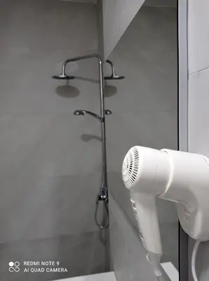 a shower with a hair dryer in a bathroom at Mars in Banja Luka