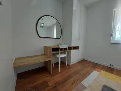 a room with a desk and a mirror on the wall at Little Aria in Ripač