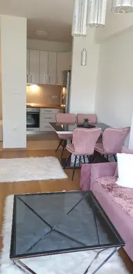 a living room with a couch and a table at Apartman Alina Comfort in Banja Luka