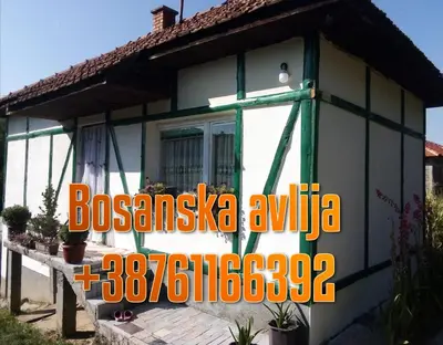 a house with a sign in front of it at Bazeni-Etno selo u Visokom in Visoko