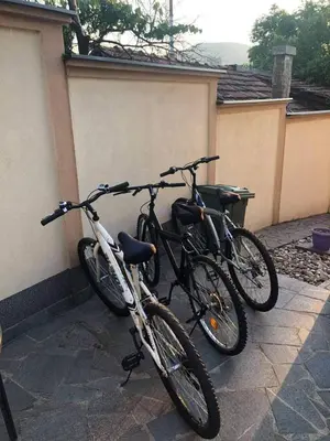 two bikes are parked next to a wall at Villa Orela Zenica in Zenica
