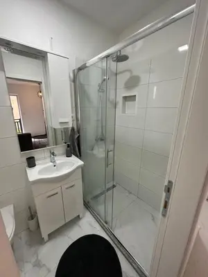 a bathroom with a shower and a sink at Lena 2 in Jajce