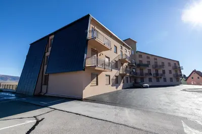 a building with a solarium on the side of it at Apartman Kupres Ski in Kupres