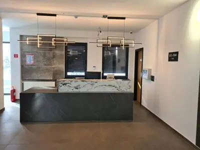 a lobby with a marble counter and a reception desk at Motel BTG in Tomislavgrad