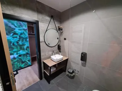 a bathroom with a sink and a mirror at Motel BTG in Tomislavgrad