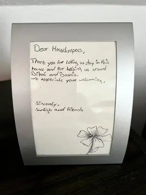a framed picture of a note with a flower at BIG Apartment 3 Bedrooms in Bihać